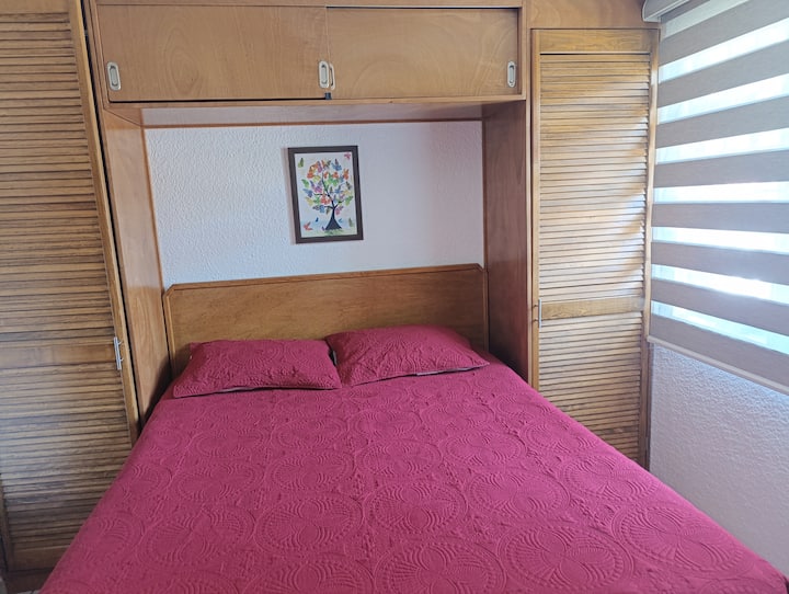 Comfortable queen-size bed, its mattress is orthopaedic for a comforting rest. 
