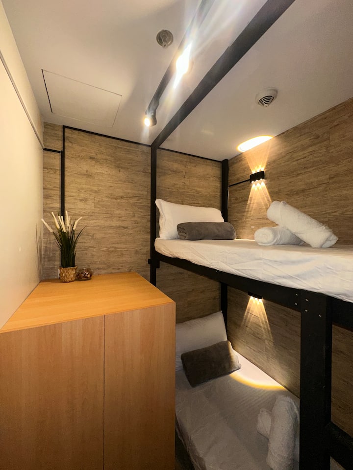 Service area converted into a small room good for 2 persons with toilet and bath.