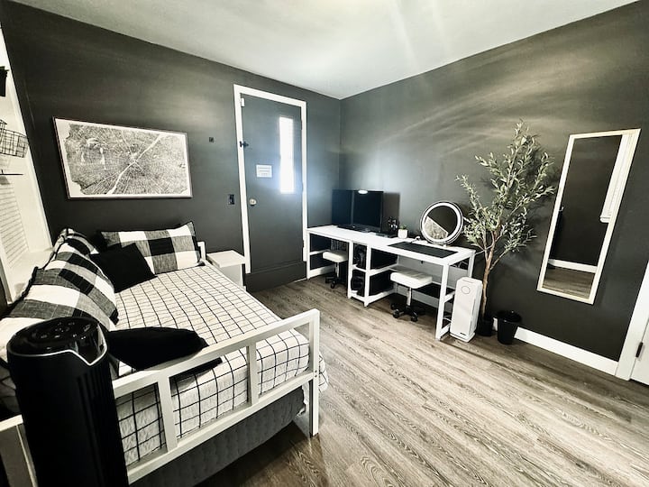 Our third bedroom features a twin bed, trundle bed, and a washer and dryer. This is the sole pet friendly space with a gate and a kennel available for use. This room is located near the main living areas, ensuring your pets are always nearby. 