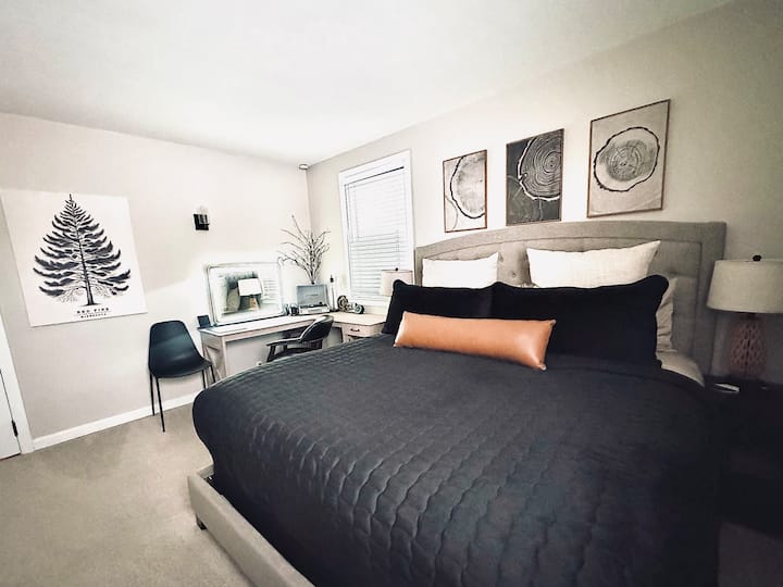 King size bed dressed in premium bedding.