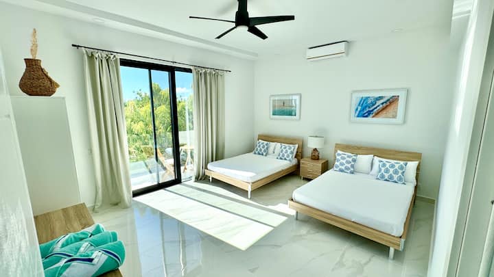 Two double-beds ocean and garden view on 2nd floor with balcony. 