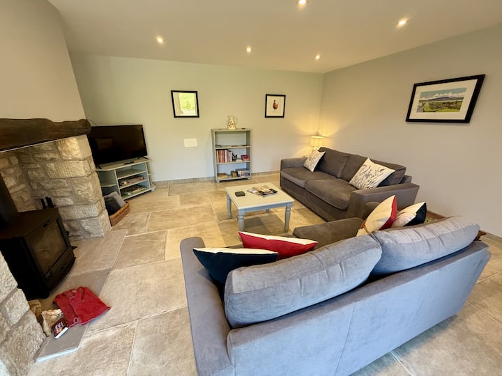 Large airy space filled with light from the full length patio doors.