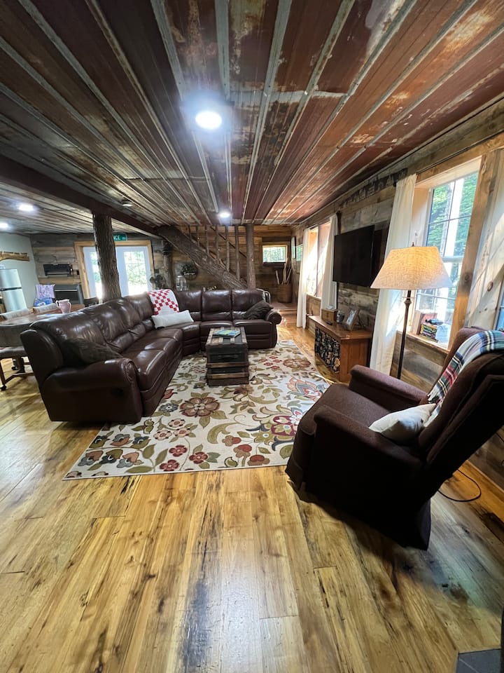 Grab the popcorn and a cozy blanket and find a spot on our luxe leather couch to watch a movie or grab a book and cozy up in the lodge rocking recliner. Plenty of seating for everyone!