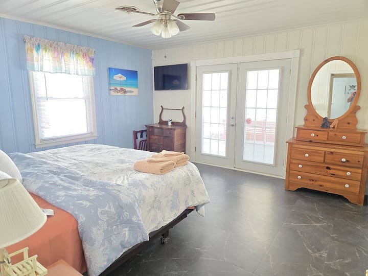 Wake up to a wonderful view of the pool  from the French doors.