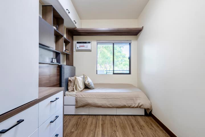 The bed offers the flexibility to be used as a single bed or extended into a pull-out, which can then be combined to form a queen-sized bed.