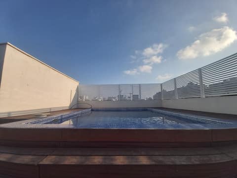 A warm swimming pool under the blue sky, parties are allowed
