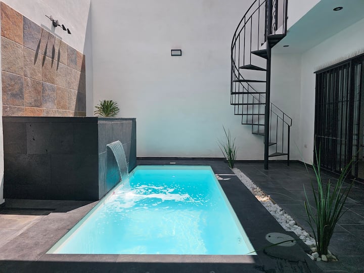 House with a pool and closed-circuit TV.