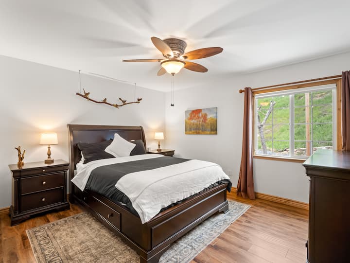 master bedroom with queen size bed and master bathroom attached
