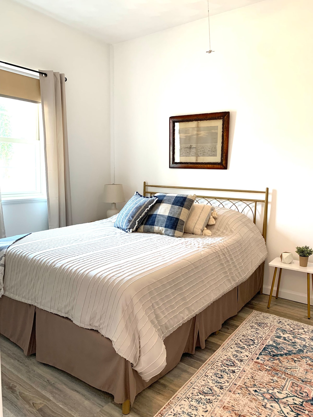 Queen sized bed with plush memory foam mattress in front bedroom 