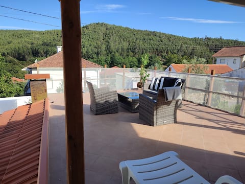 House in small village near river shore.