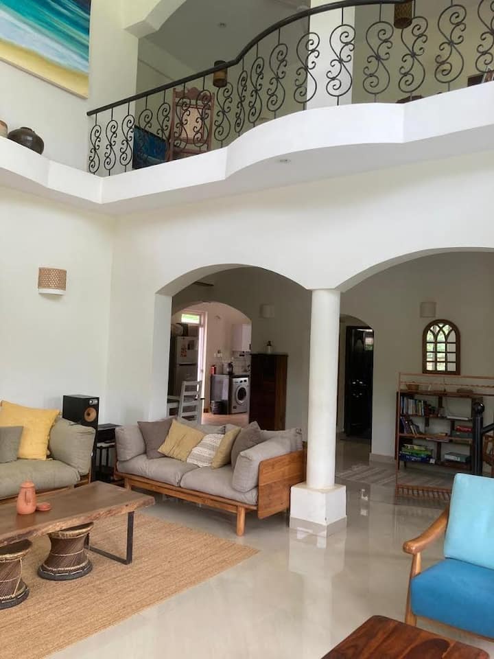Looking towards the kitchen and dining room (on the left) and the ground floor guest room on the right.