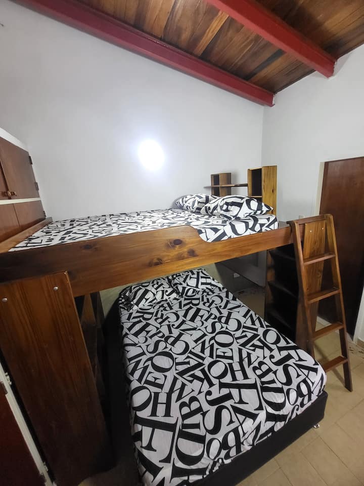 Room number one has two double beds. The room includes an internal bathroom for comfort and privacy. It also has a closet for the storage of belongings.