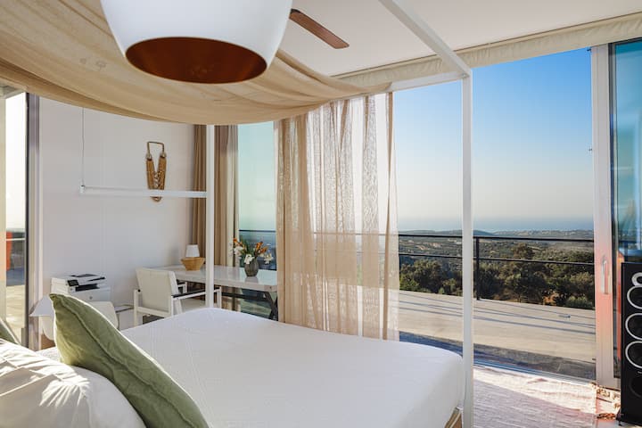 Ascending to the first floor, you will find the master bedroom, featuring a king-size bed (1.80m x 2.00m) and an en-suite bathroom with a walk-in shower.