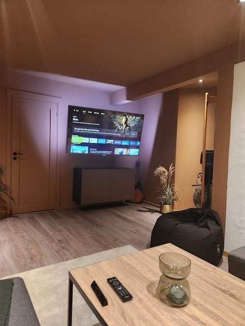 Bedroom/living room and private bathroom by the lake at Vikhammer.