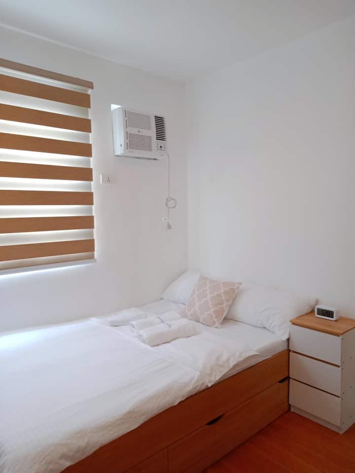 Twin bed with comfortable mattress and brand new inverter aircon