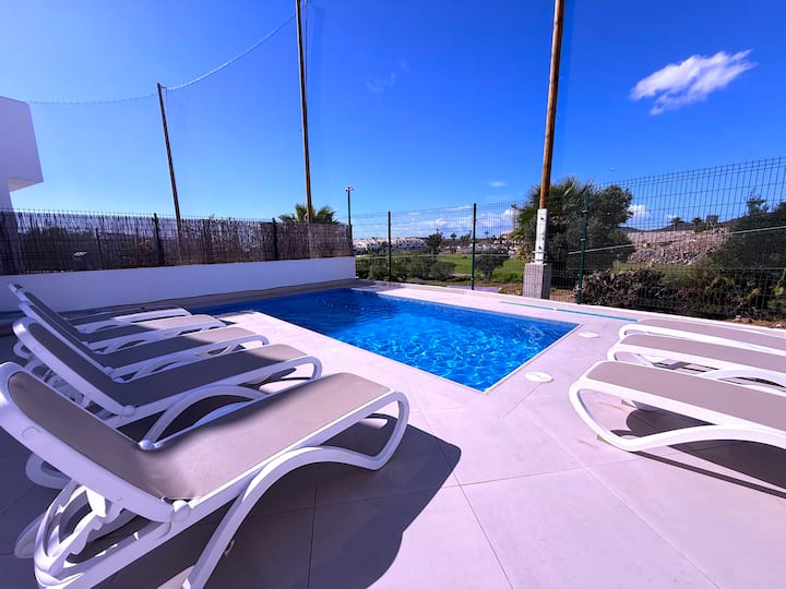 Villa 13 · Modern Princess, Amarilla Golf — pool terrace with sun loungers