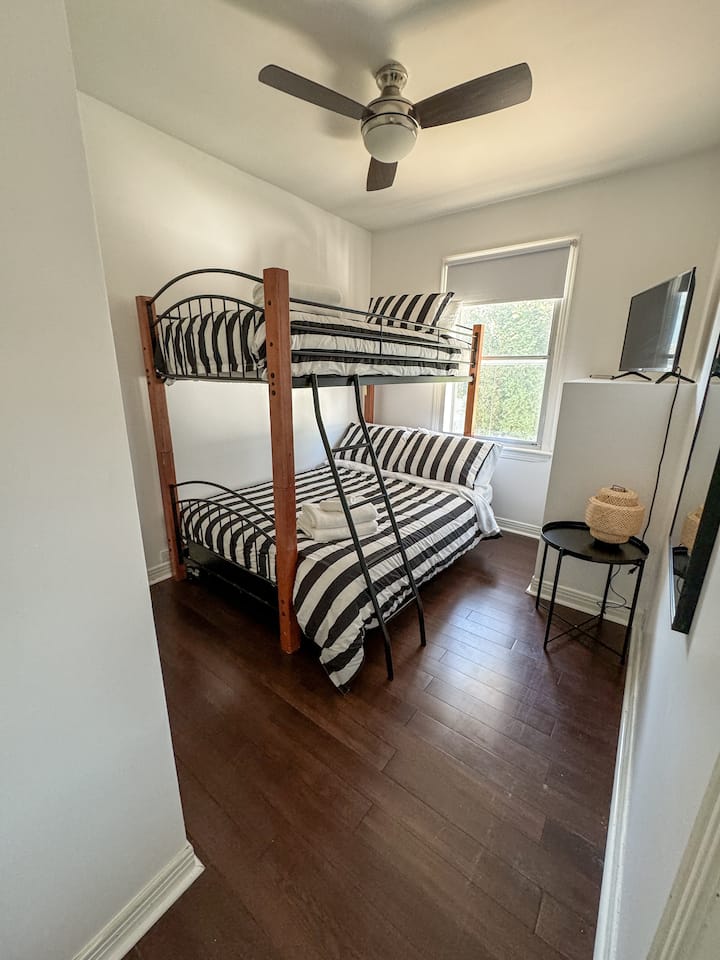 A twin bed over a double bed. The Bottom bunk is also a futon and can fold into a couch. 