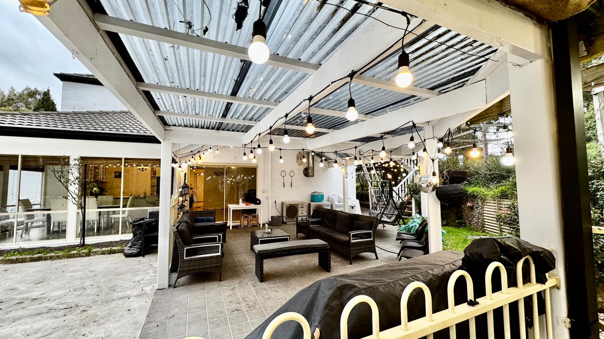 Covered entertaining deck with lights and BBQ area