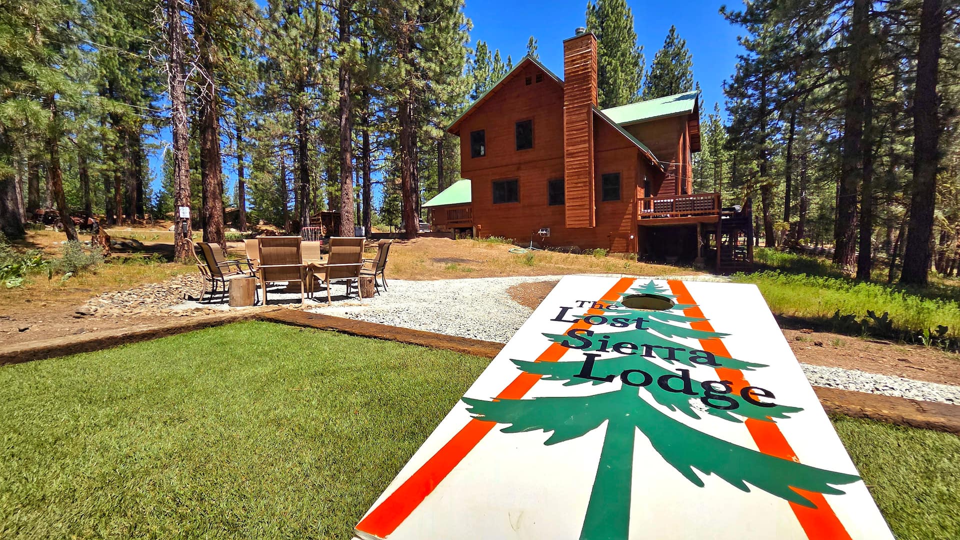 Lodge, lawn and cornhole