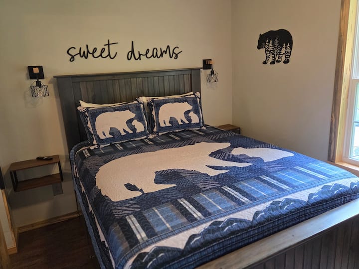 Custom built Queen size bed with drawers under it.  Room features 2 small closets,  a desk/ chair space for work or gaming and a 42" flat screen tv.