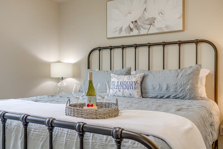 Peaceful bedroom with plush blue bedding and a touch of local charm.