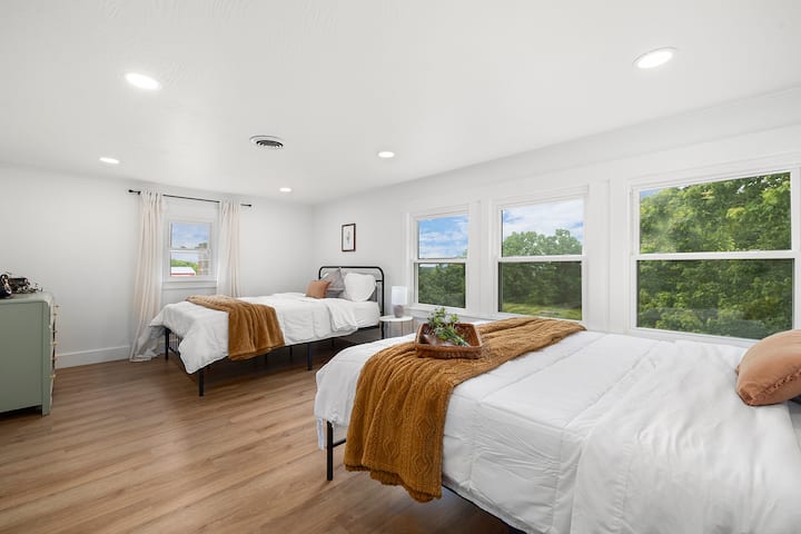Bedroom 3 from another angle showing window placement and comfortable room scale.