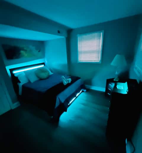 Basement with color-changing LED beds and dressers