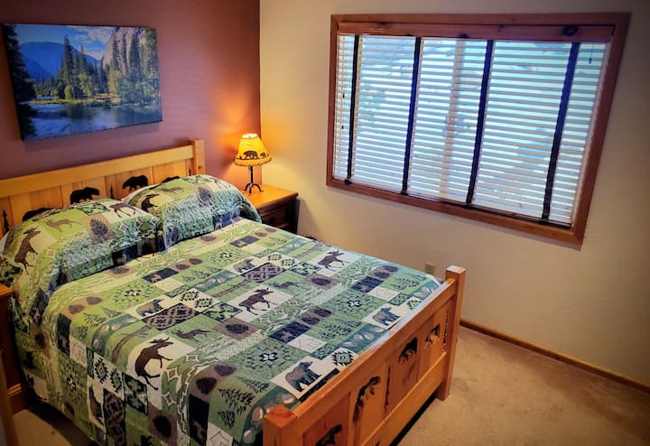 Relax in the Bear Bedroom with Your Quiet Queen Bed, Queen Memory Foam Floor Mattress, Large Window, Wooden Louvered Blinds and Closet Doors just a Few Steps From Full Bath.