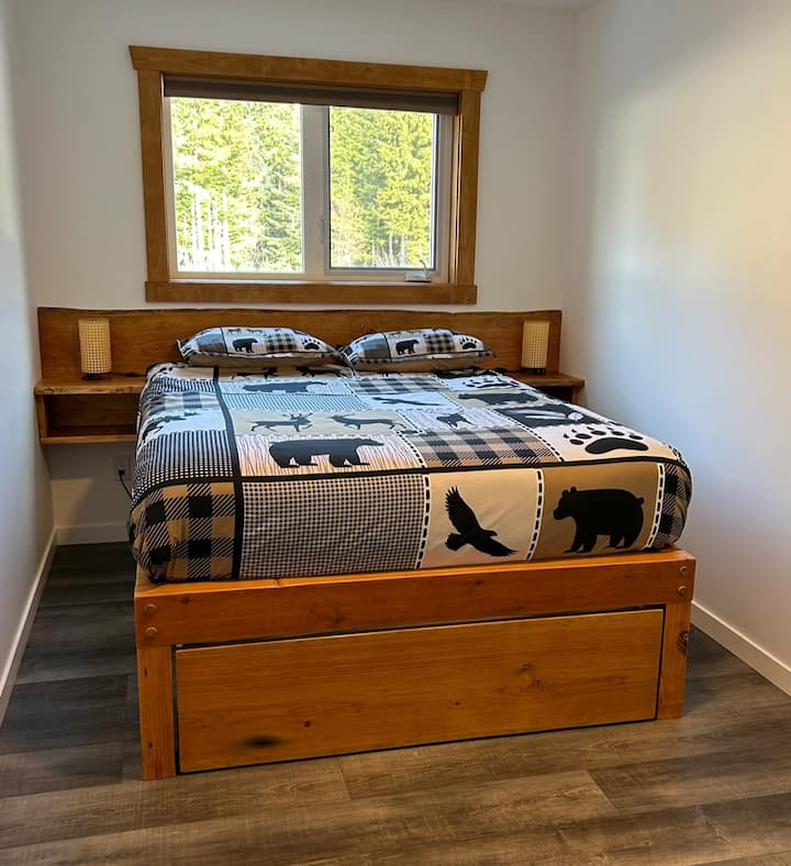 Main floor bedroom with Queen and Double trundle.