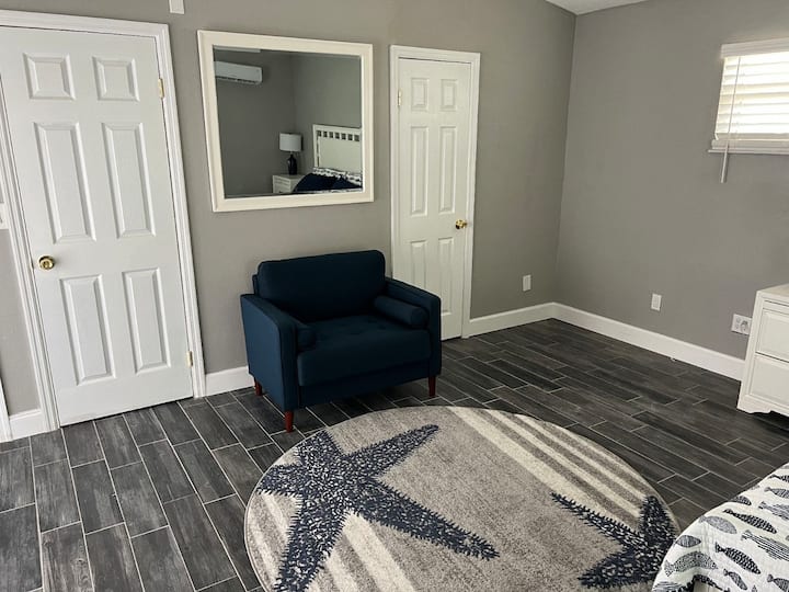 The 2nd floor Master includes a king bed, 58" inch wall mounted smart TV, a sitting area, walk in closet, and a ensuite including a walk in shower