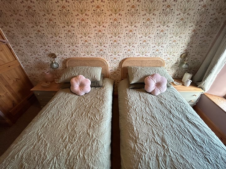 Our second bedroom can be set up as a twin or a super king-size bed with comfortable mattresses and a quilt to snuggle in to. Both our rooms have black out blinds ensuring you get a good nights sleep 