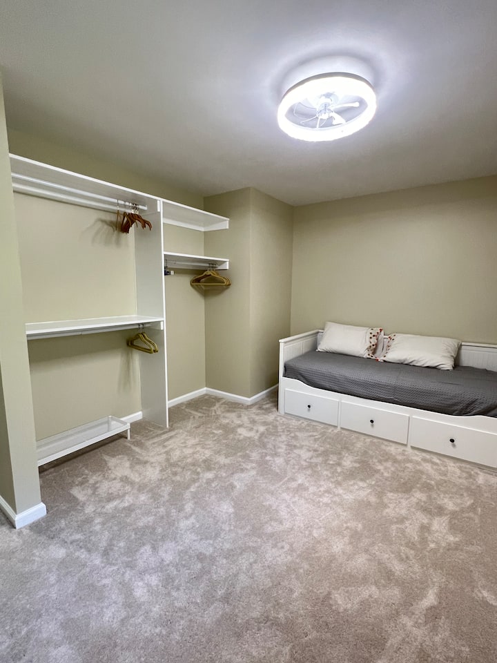 This room has a Trundle Bed which can be used as one single bed (with 2 mattresses underneath as shown), or pull out the bottom and slide one mattress over to have 2 single beds.  Note: bottom trundle does not detach from bed).  32" TV in room.