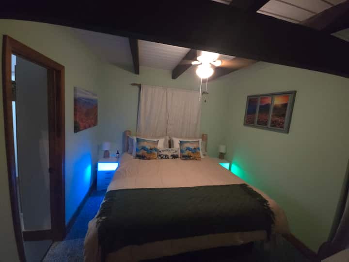 Large, comfy king size bed with soft cozy comforter and soft sheets. This is the ensuite bedroom/full bathroom on main level.