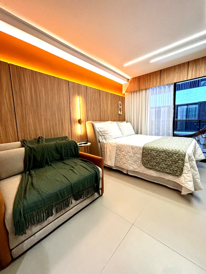 The room has a double bed and also a very comfortable single sofa bed