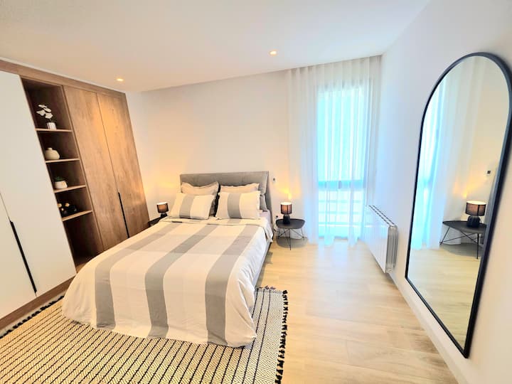 A cozy haven where every night is blissful: a plush bed, soft lighting, pristine linens, and comfortable cushions. A soothing haven to unwind, dream, and wake up feeling serene, just like at home.