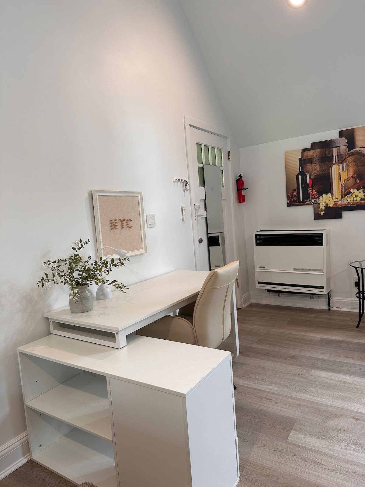 Equipped kitchenette with electric cooktop, microwave, and coffee maker