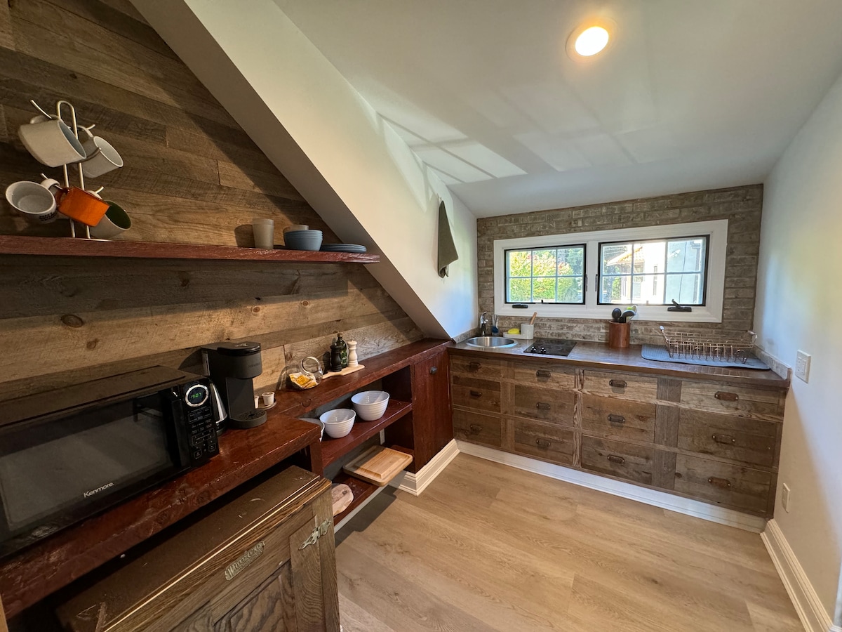 Double bed in the wood-paneled loft