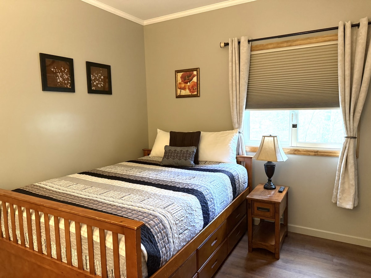 Queen bed with trundle underneath.