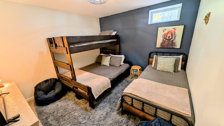 Bedroom 2: Twin over queen bunk bed with an additional twin bed, smart TV, puzzles, games, toys and books, bean bag chairs