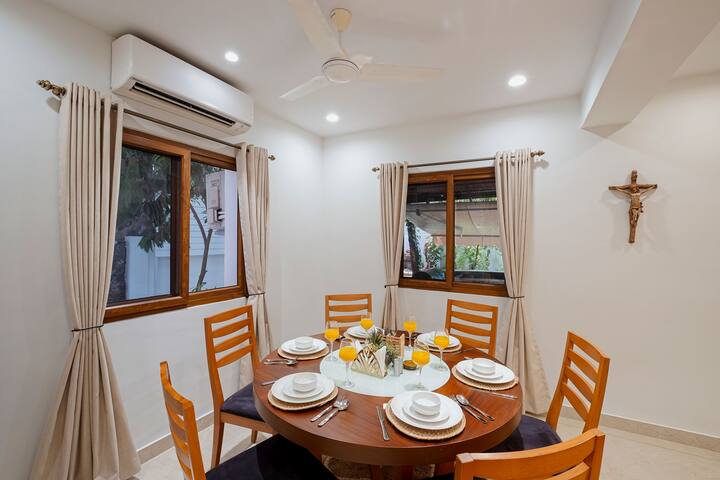 Cozy Dining Area in this Space , with all the required Cutlery and with Ac in this area.