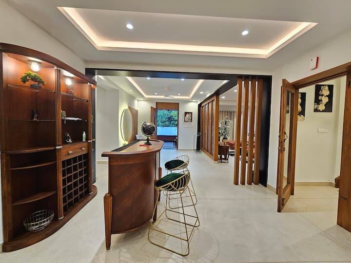 A Large Bar area alongside the foyer which is right next to the living area