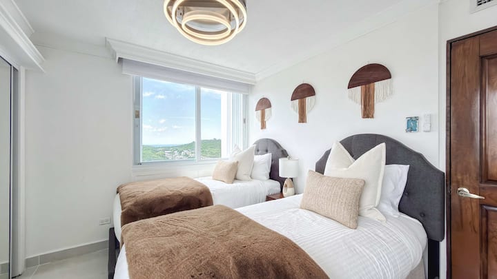 The second bedroom sleeps 2 guests on 2 cozy and comfy twin size beds. The bedroom features AC, closet, blackout shades and amazing ocean, mountain and pool views.
