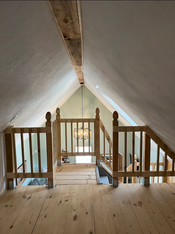 Open loft offers full bed as well as 2 futons. 