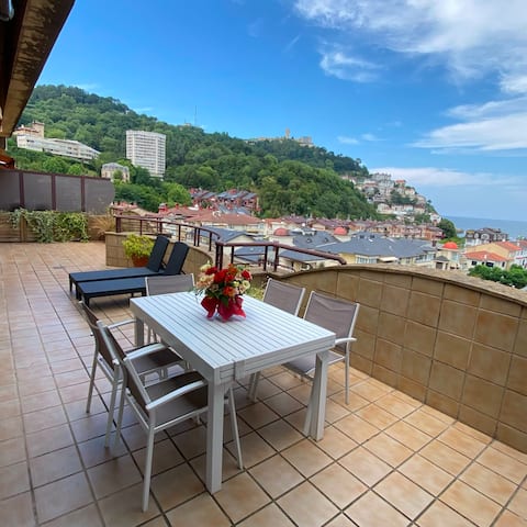 On the beach, with a terrace and parking