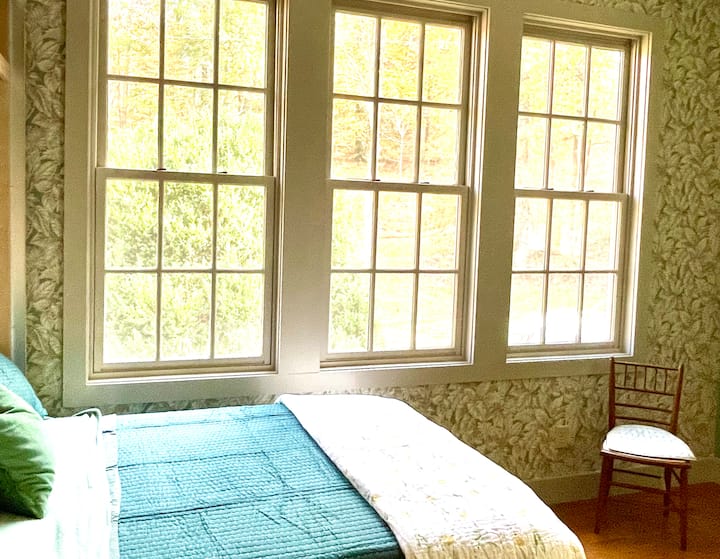 The music room is newly papered in 1930s wallpaper, and has a very comfortable, European-sized (small full) Murphy bed. It does not have curtains, and may be a better fit for a child or smaller adult. 