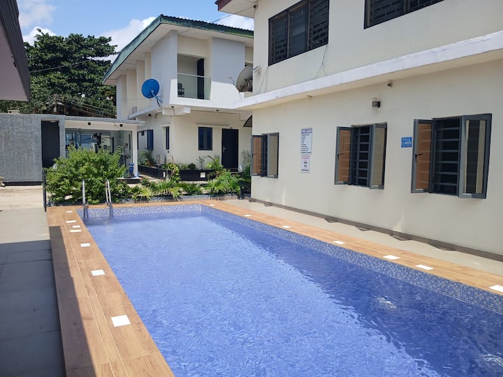 Enchanting 2-Bed Home with Pool, Gym & Fast Wi-Fi