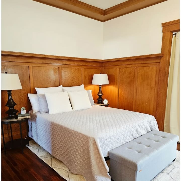 Comfortable Double Bed in open room. Has built in drawers for storage 