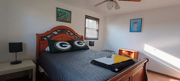 Queen bed and night stands in room 1.