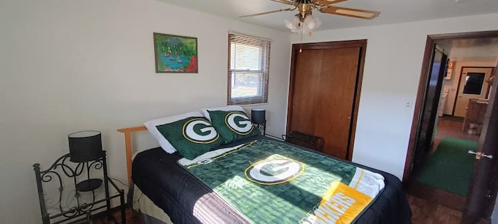 Queen bed with night stands in room 2.