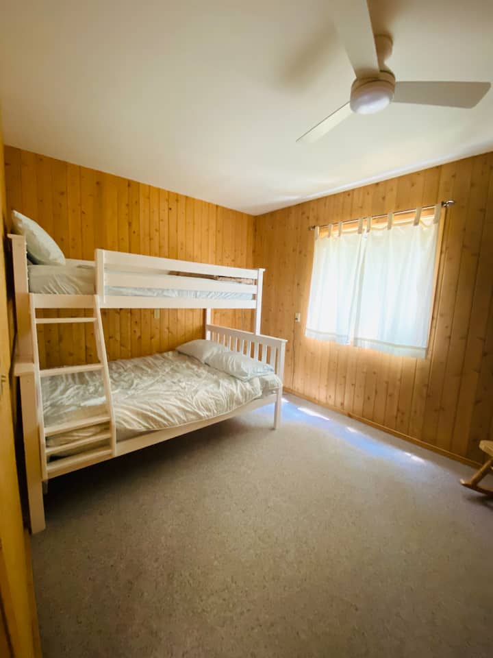 Downstairs bedroom with bunk beds. One twin and one full bed.